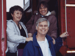 Pam, Bob and Lia Boarding a Train